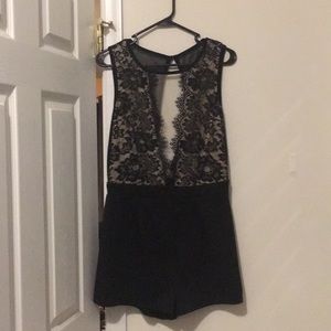 Black romper, deep plunging front